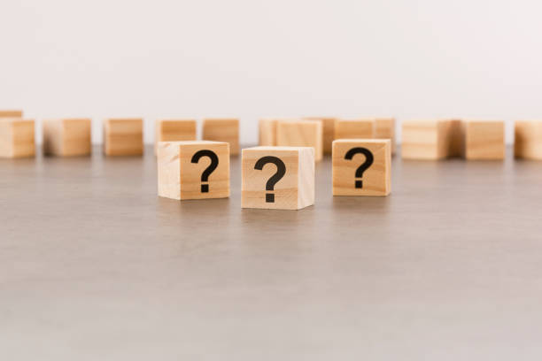 istock front view on many wood cubes with question marks. many question arising concept 1413632496