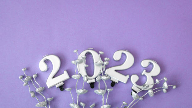istock Lilac Christmas background with numbers 2023 and decor details, flat lay. 1413636148