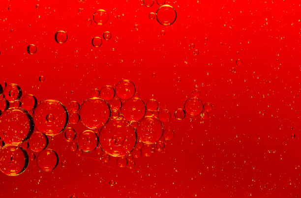 istock Red macro bubbles,Backgrounds, Abstract Backgrounds, Soda, Red, Carbonated,Beauty concept background. Closeup cosmetic liquid gel with bubbles on red colors background 1413637854