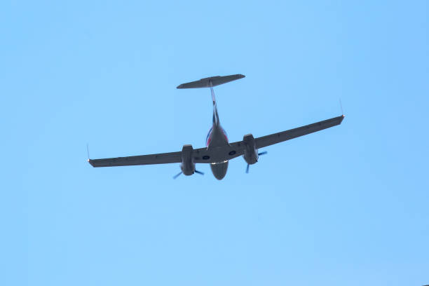 istock twin-engine light aircraft flying in the sky 1413638192