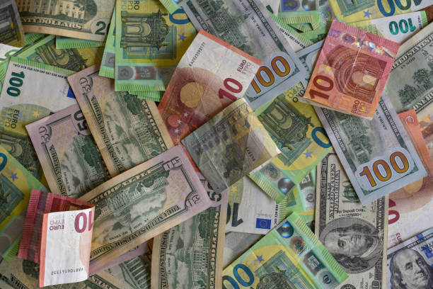 istock money mixed euro and dollar bills 1413639300