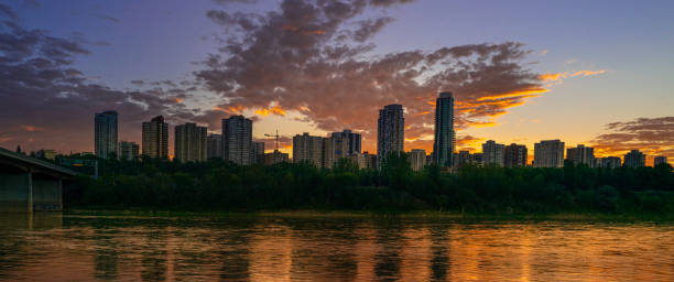 istock Edmonton skyline and dramatic cloudscape at sunrise at Emily Murphy Park, over North Saskatchewan River in the Province of Alberta, Canada 1413639487