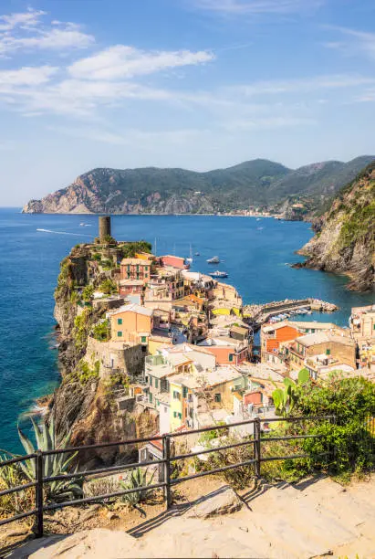 A view, with a stepped footpath in the foreground, of the town Vernazza, one of the idyllic Cinque Terre towns in northern Italy.