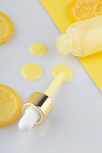 istock Cosmetic bottle product serum vitamin C 1413640898