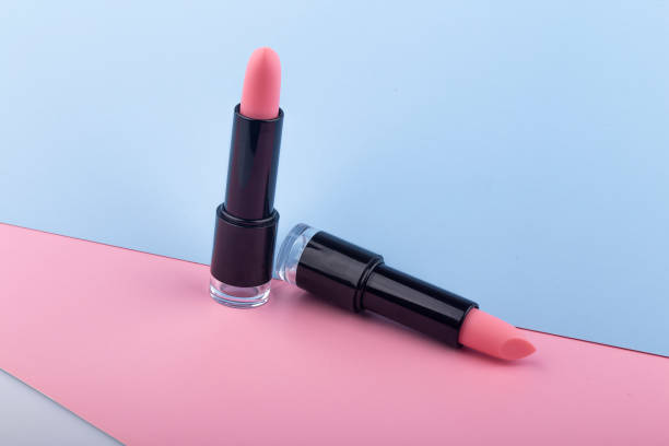 istock Pink lipstick isolated on pink background 1413640989
