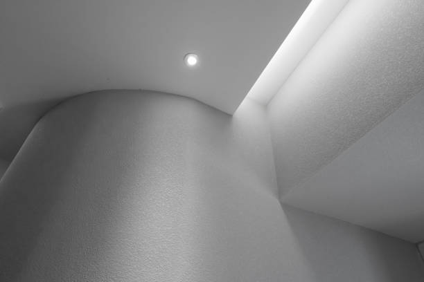 A shot of an upward view of the circular architectural opening against the backdrop of a clear sky, showcasing the modern design and symmetry.