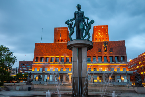 Oslo city hall at dramatic evening with fountain, Norway, Scandinavia, long exposure