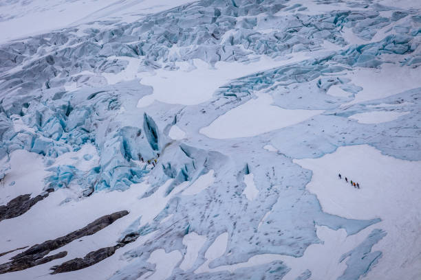 istock Briksdalsbreen arm of Jostedalsbreen glacier with alpinitst in Norway 1413644248