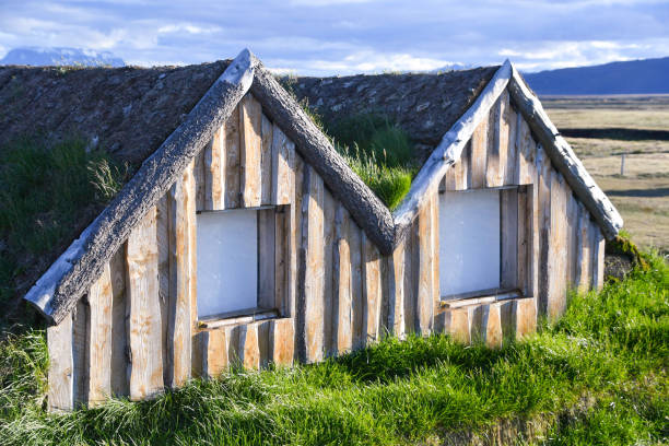 Closeup of Turf house of Iceland - Northen Europe Small house with grass-covered roof as a thermal insulator - Viking tradition of Iceland where houses are built with grass-covered roofs sod roof stock pictures, royalty-free photos & images