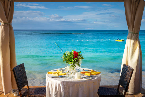 istock Romantic table for two and Beach with gazebo at sunset, Montego Bay, Jamaica 1413646115