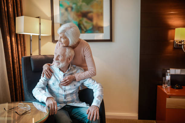 istock Elderly couple in a nice room looking happy and peaceful 1413646869