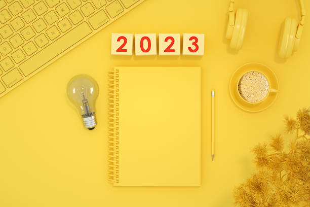 istock 2023 new year blank page notebook yellow background 1413646871