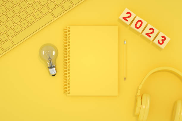 istock 2023 new year blank page notebook yellow background 1413646900
