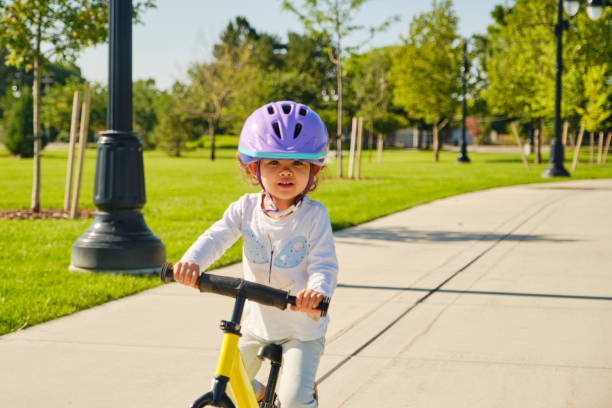 istock Toddler Girl Wearing a Bicycle Helmet 1413648024
