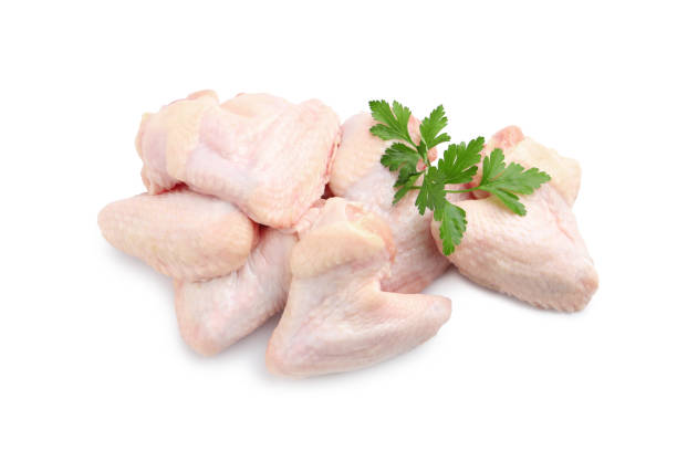 istock Raw chicken wings with parsley on white background, top view 1413648241