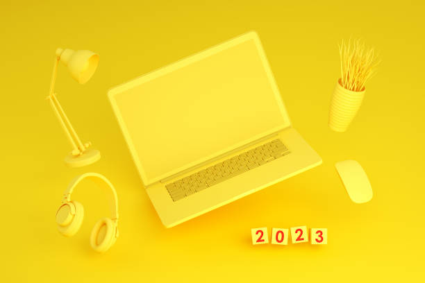 istock 2023 New Year, Flying Blank Screen Laptop on Yellow Background 1413648600