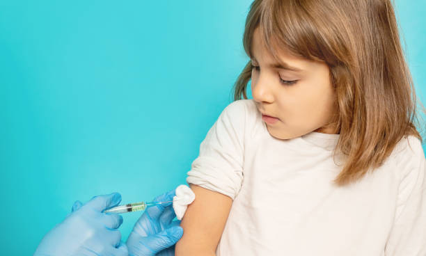 istock Girl Taking Vaccination From Doctor 1413651411