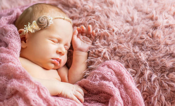 istock Baby Girl Sleeping On Bed 1413651693