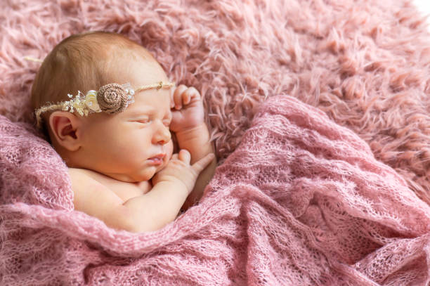 istock Baby Girl Sleeping On Bed 1413651696