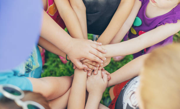istock High Angle View Of Kids With Stacked Hands 1413652147