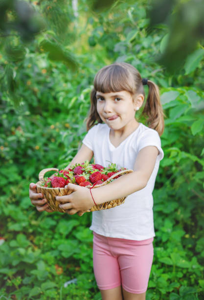 istock Side View Of Young Woman Standing Against Plants 1413652149
