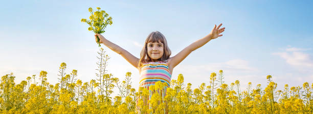 Free Stock Photo of Little Girl Standing in Yellow Flower Field ...