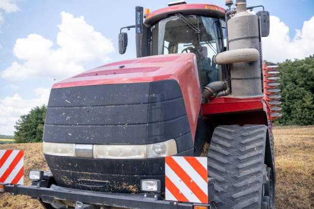 Agricultural tractor on the highway road in Poland.