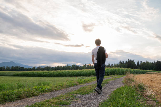 istock Man walking through beautiful landscape 1413653283