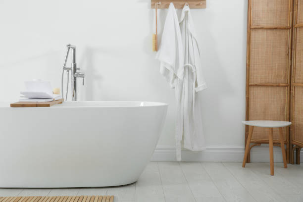 istock Stylish bathroom interior with modern white tub 1413653542