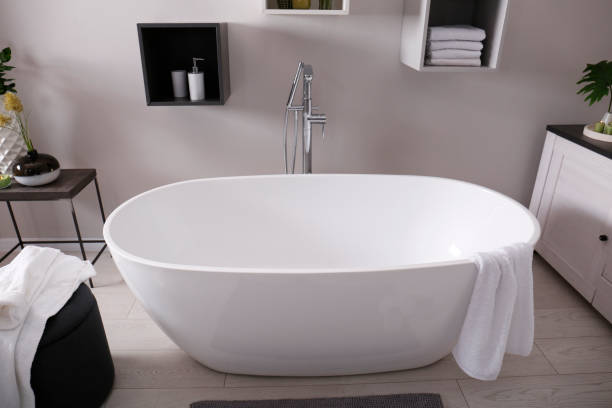 istock Stylish bathroom interior with modern white tub 1413653571