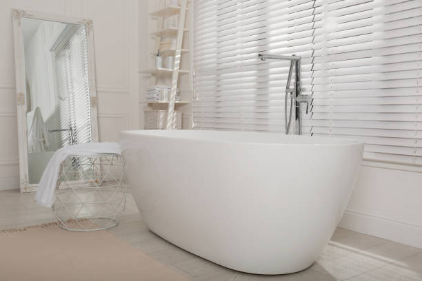 istock Minimal bathroom interior with modern white tub 1413653586