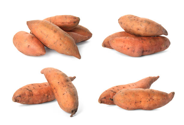Set with fresh sweet potatoes on white background