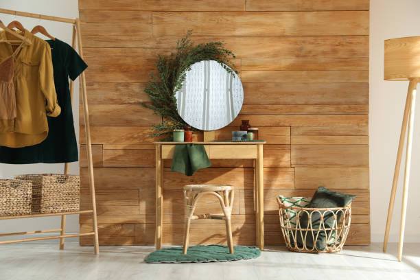 istock Stylish dressing table and mirror decorated with green eucalyptus in room 1413653648