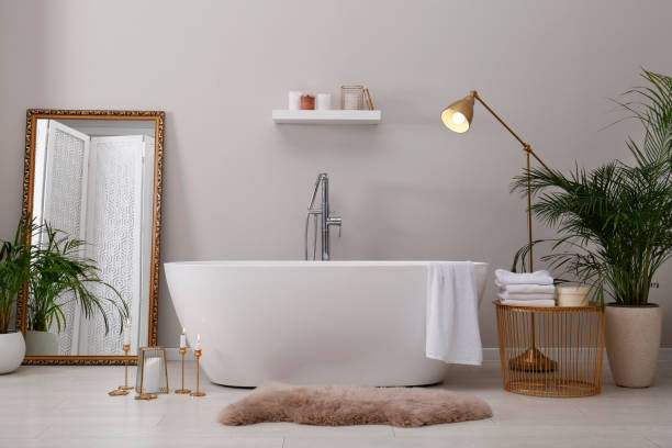 istock Stylish bathroom interior with modern white tub 1413653653