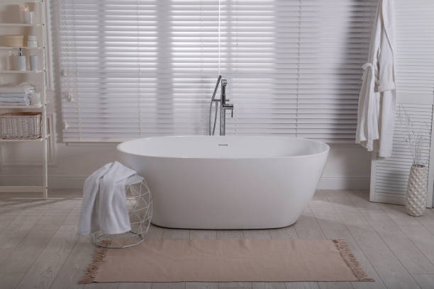 istock Minimal bathroom interior with modern white tub 1413653656