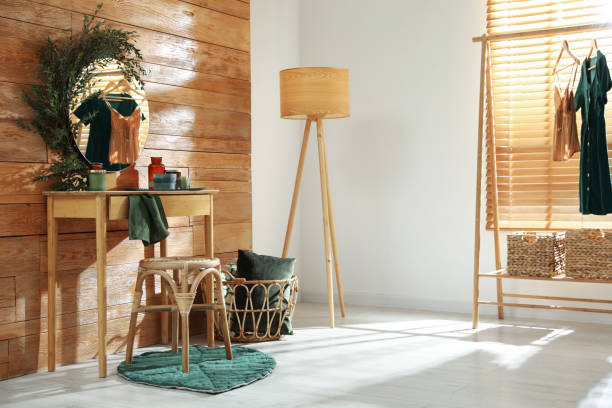 istock Stylish dressing table and mirror decorated with green eucalyptus in room 1413653674