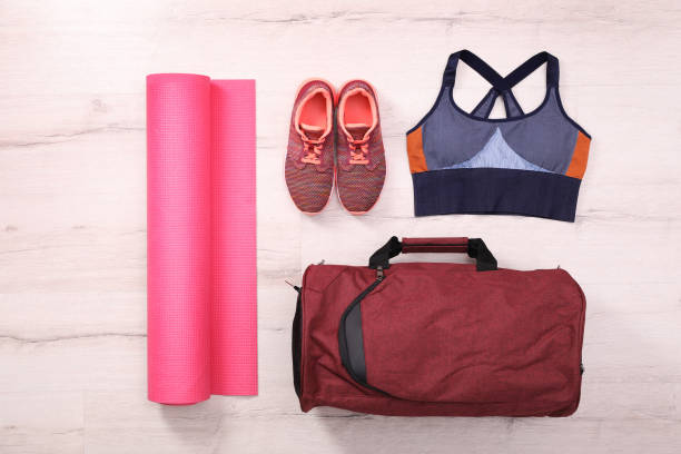 istock Red bag and sports accessories on floor, flat lay 1413653763