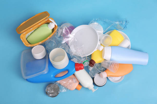 istock Pile of plastic garbage on light blue background, flat lay 1413654409