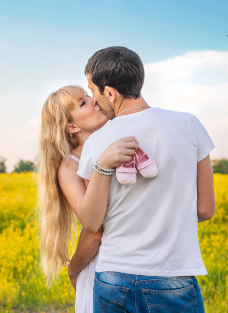 istock Couple Kissing Each Other In Field 1413654515