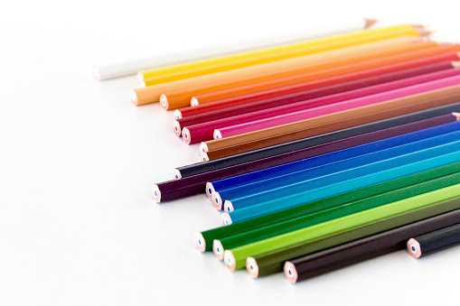 Multicolored pencils, colored pencils on white background.