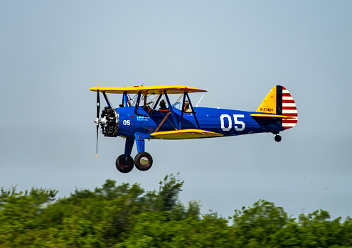 A colorful Boeing-Stearman model 75 aircraft. It was used as a military trainer in the 1930s and 1940s. Over 10,000 of the biplanes were built. It had a top speed of 125 MPH and carried a student and instructor.\nMineral Wells, TX\n05/06/22