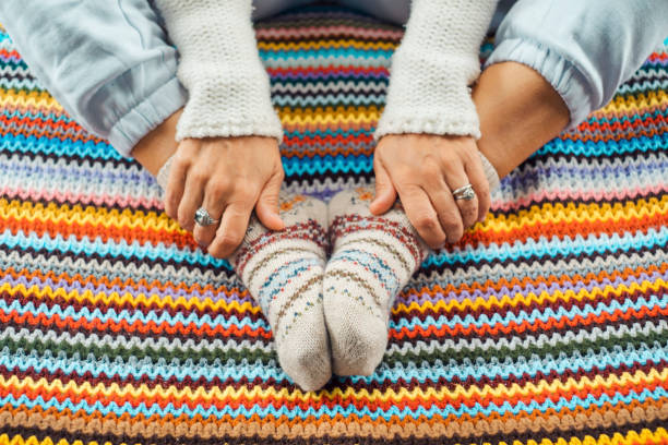 istock Low Section Of Woman Wearing Socks 1413659289