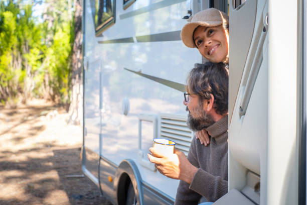 istock Couple Sitting In Camper Van 1413659296