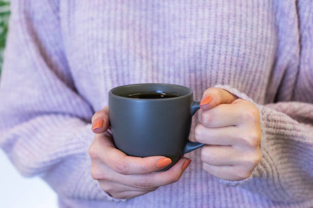 istock filter coffee in white mug, woman holding in hand 1413660578