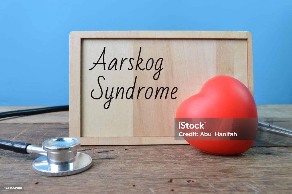 Stethoscope, red heart shape and wooden board written with text Aarskog Syndrome Stethoscope, red heart shape and wooden board with text Aarskog Syndrome Barefoot Stock Photo