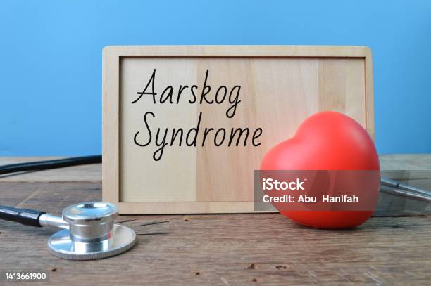 Stethoscope Red Heart Shape And Wooden Board Written With Text Aarskog Syndrome Stock Photo - Download Image Now