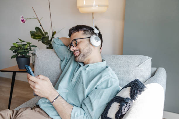 istock Relaxed man listening music. 1413662196