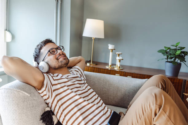istock Side view of man relaxing with music. 1413662292