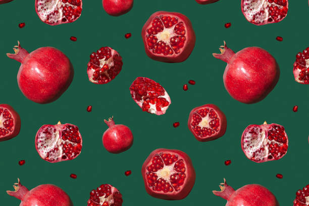 istock Seamless pattern of pomegranate on a green background. 1413663227