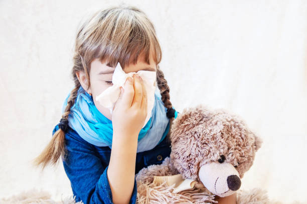 istock Ill Girl Sitting With Teddy Bear 1413663316